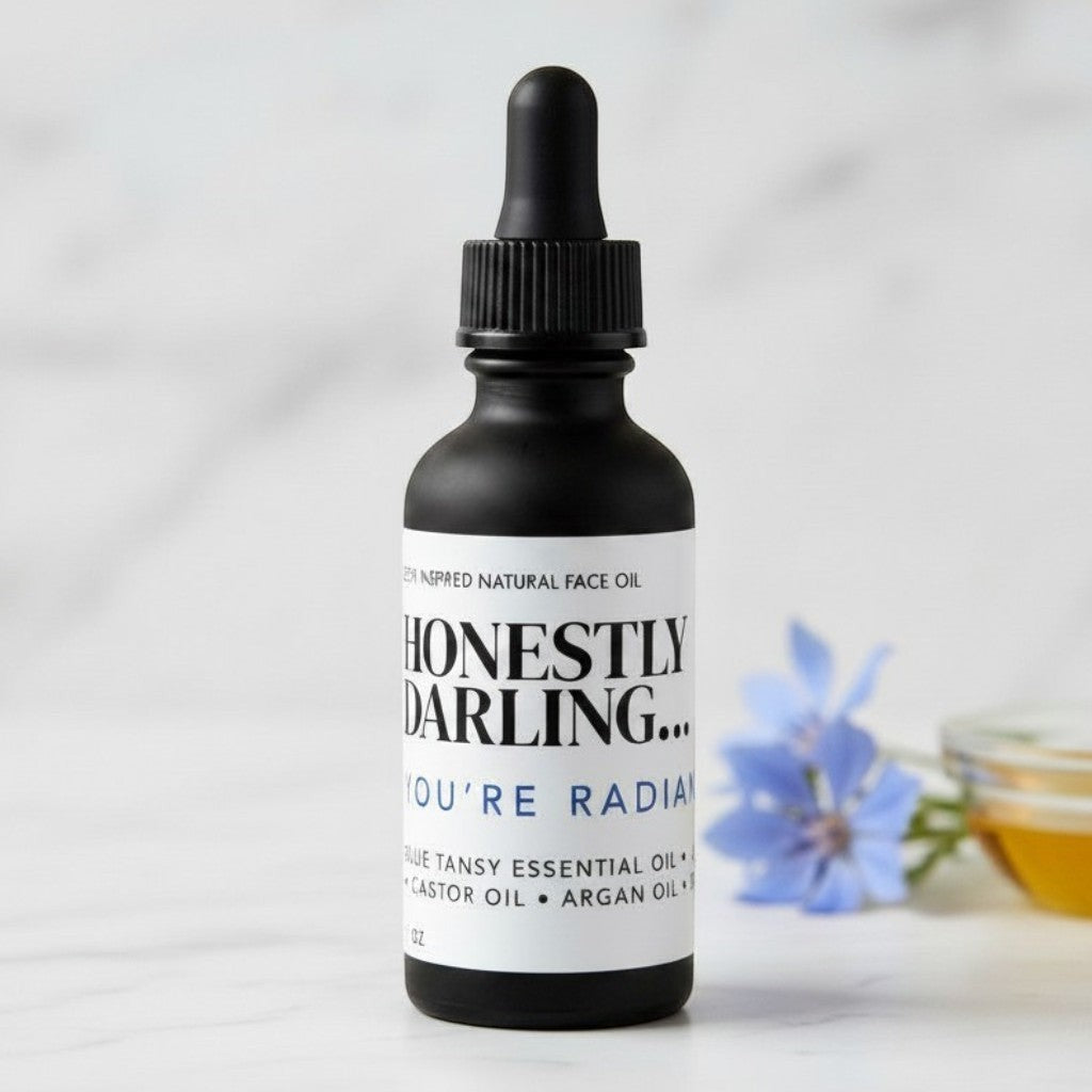 Ohm and Ember Candles Honestly Darling face oil with blue tansy, rosehip, argan, jojoba, and castor oils for a dewy glow.